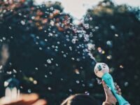 person's hand holding bubble toy