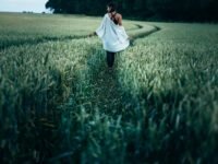 woman walking on grass field