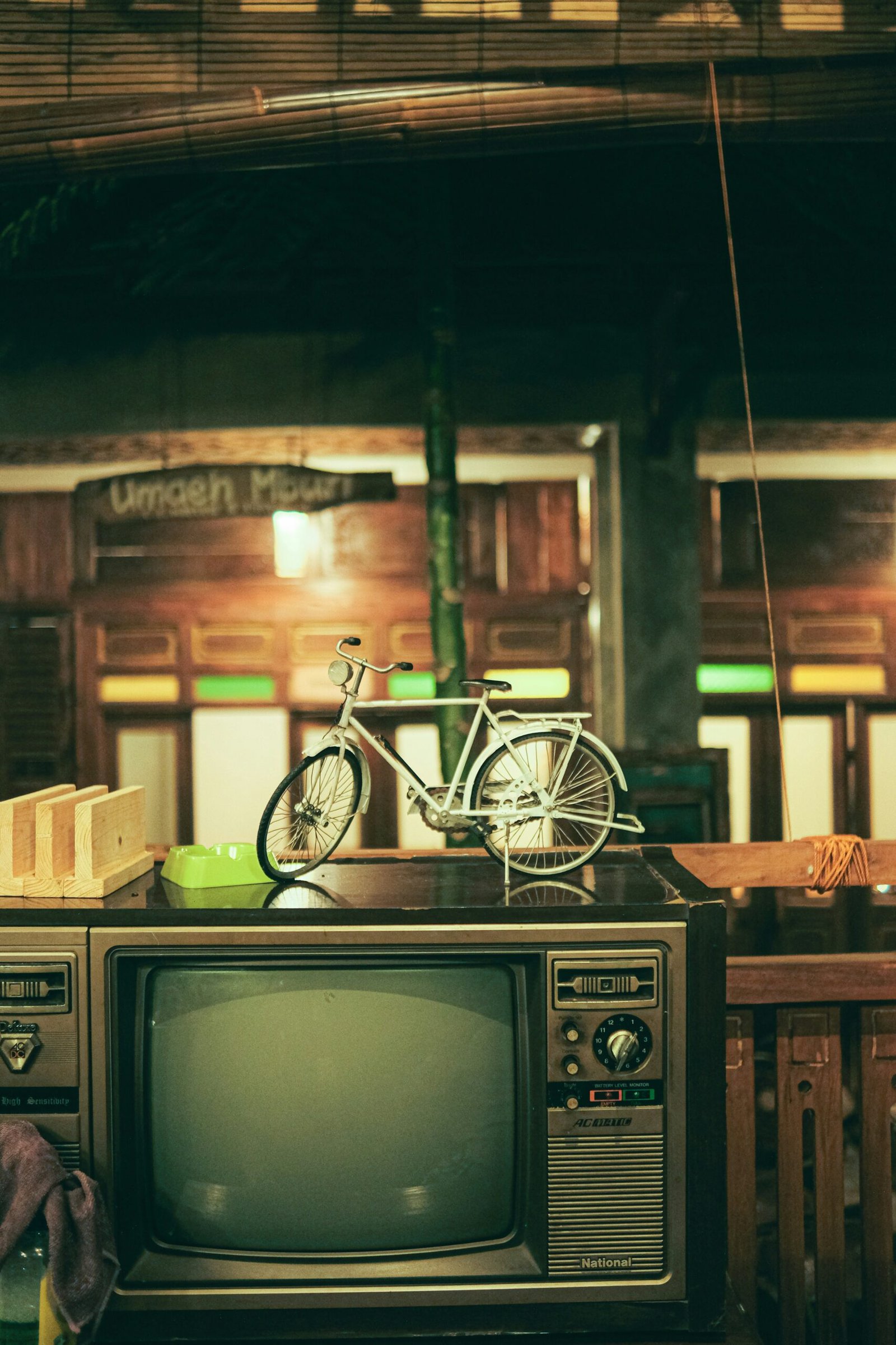 an old tv sitting on top of a wooden table